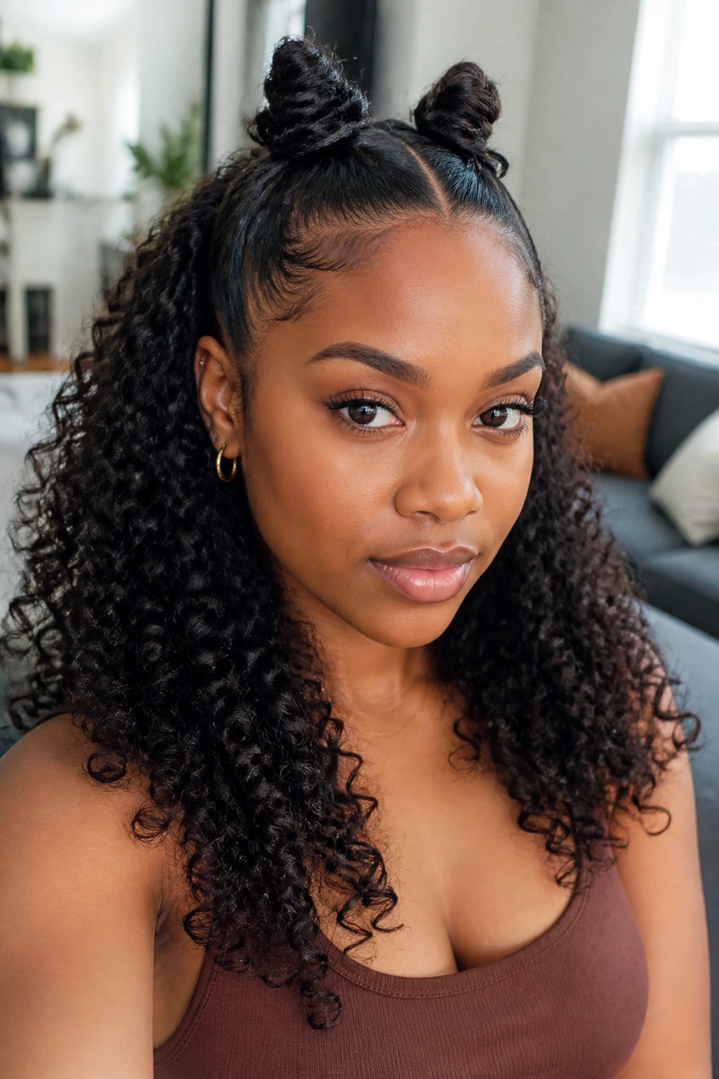 Portrait of a woman with two front Bantu knots and loose curls