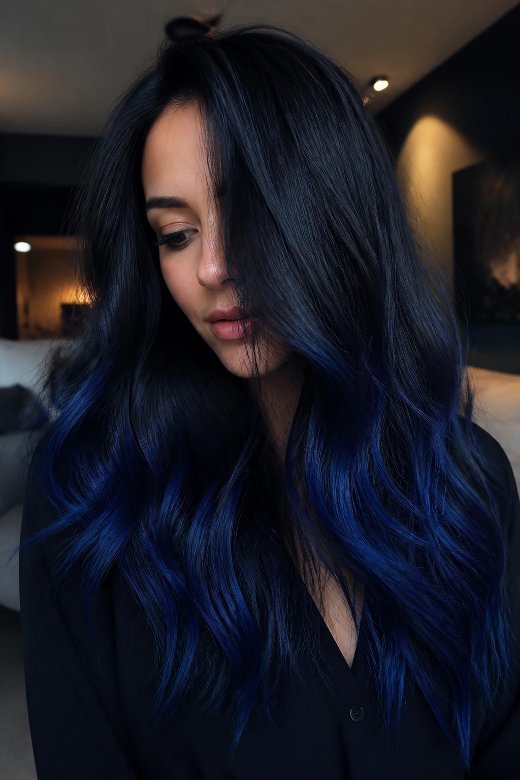 Close-up of a real woman's ink-black to sapphire color melt