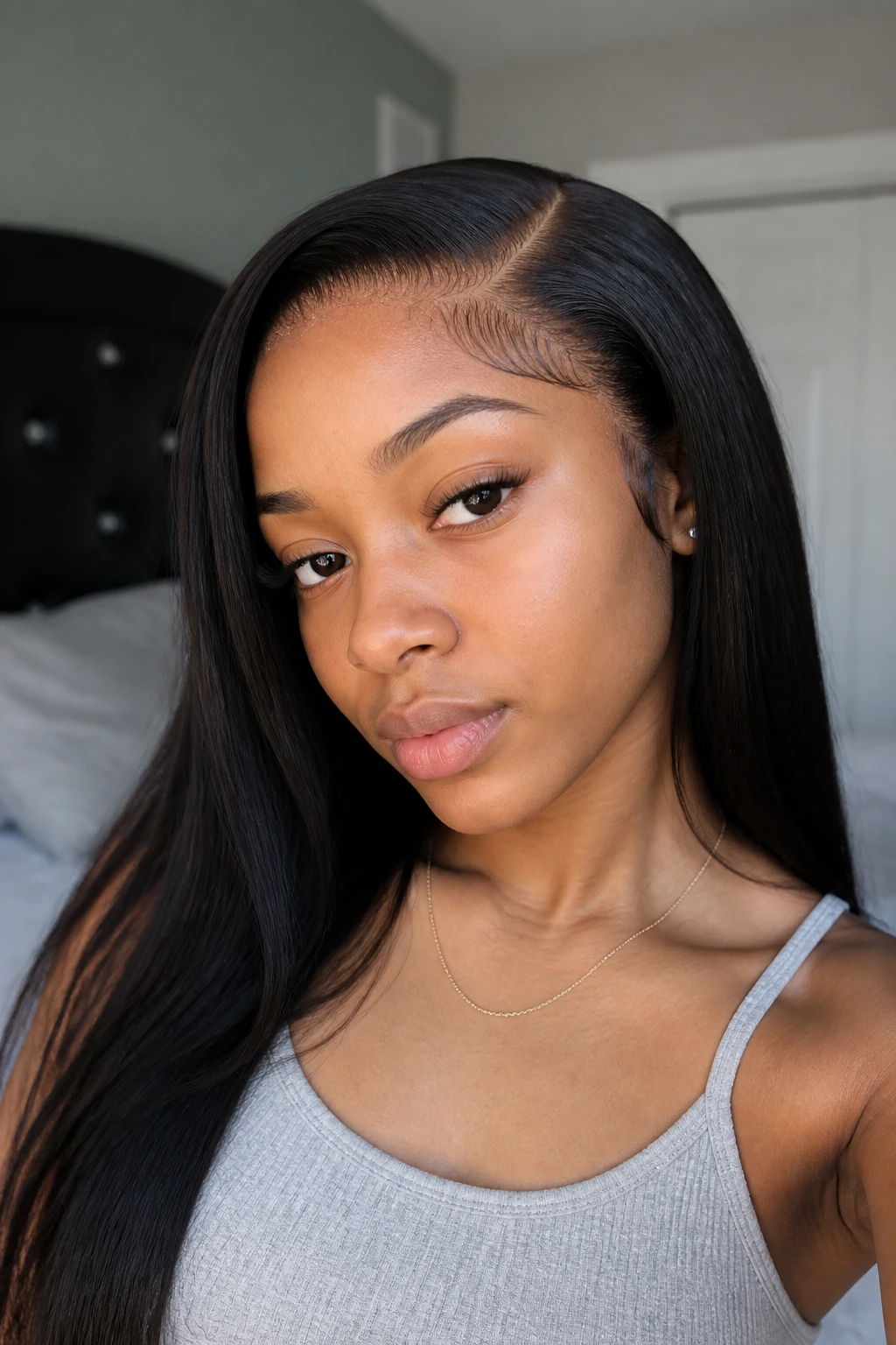 Close-up of a real person wearing a lace-front wig with bleached knots for a natural scalp look