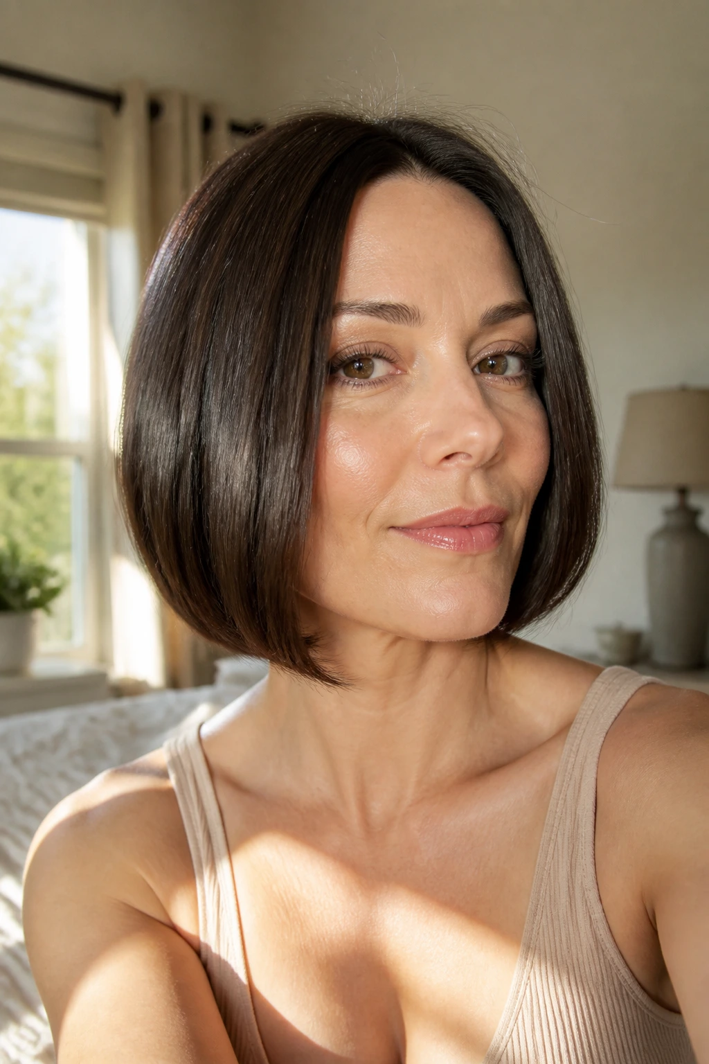 Close-up of a real woman with a blunt bob in cozy morning light