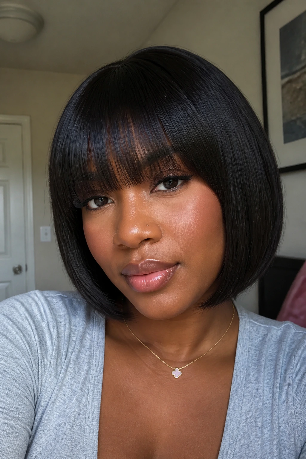 Portrait of a real person wearing a glossy bob wig with bangs