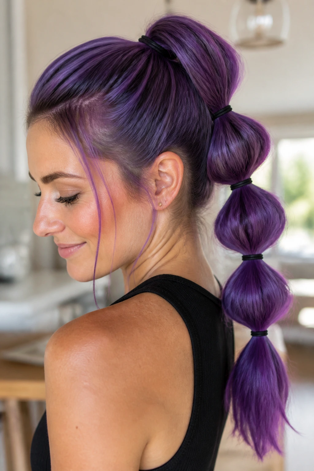 Close-up of real person with bubble ponytail on purple hair
