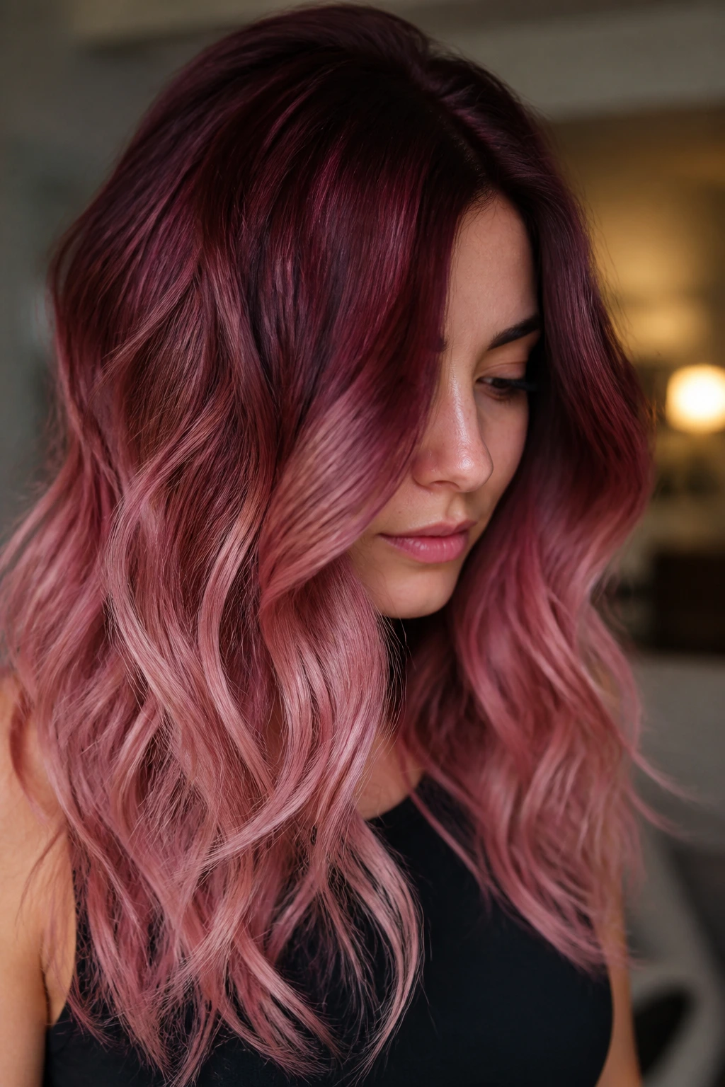 Close-up of a real woman's burgundy to rose gold color melt