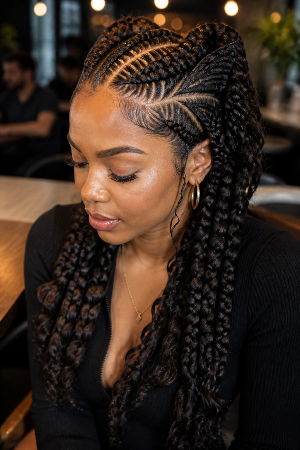 Close-up of a real woman with butterfly braids in a cafe setting