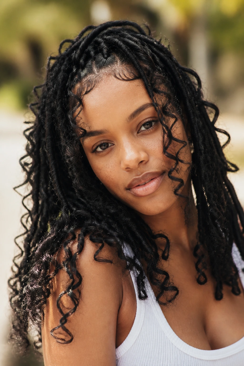Close-up of a real person with butterfly locs and looped sections