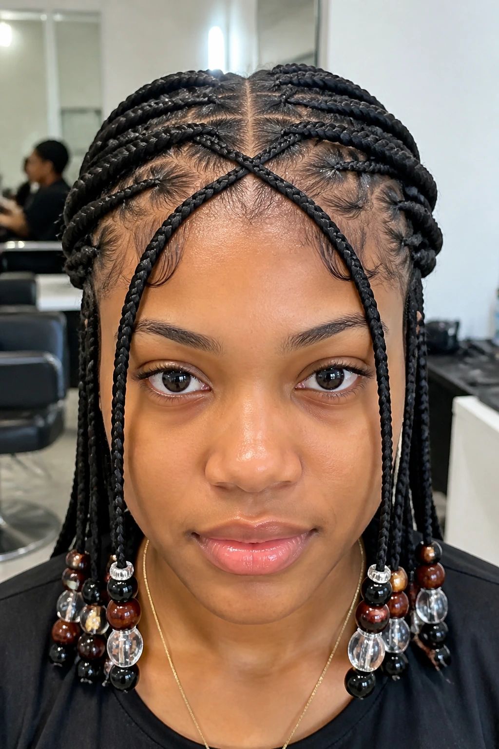 Close-up of a real person with front criss-cross braids forming an X