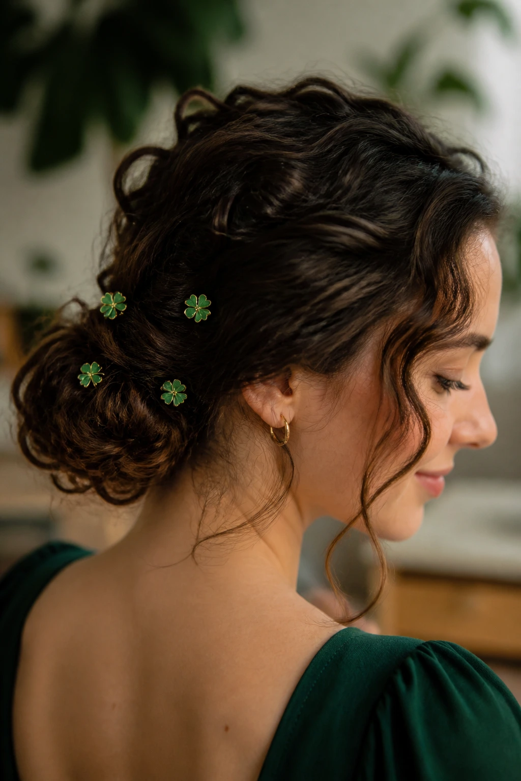 Low curly chignon with shamrock pins on a real person