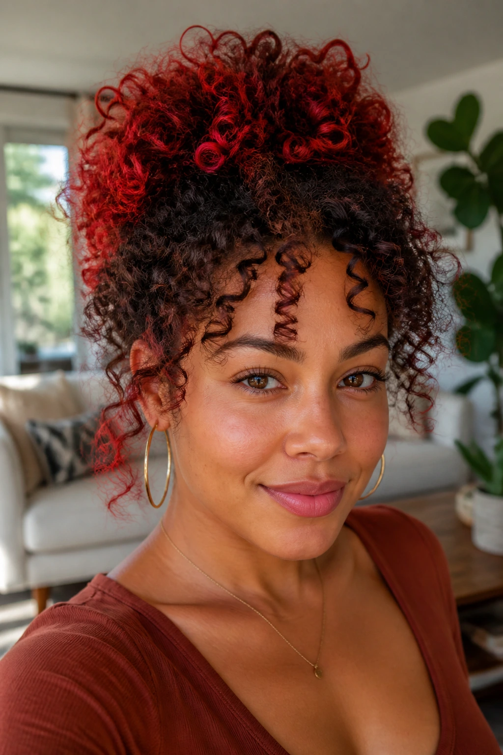 Close-up of real woman with curly hair showing red halo at crown