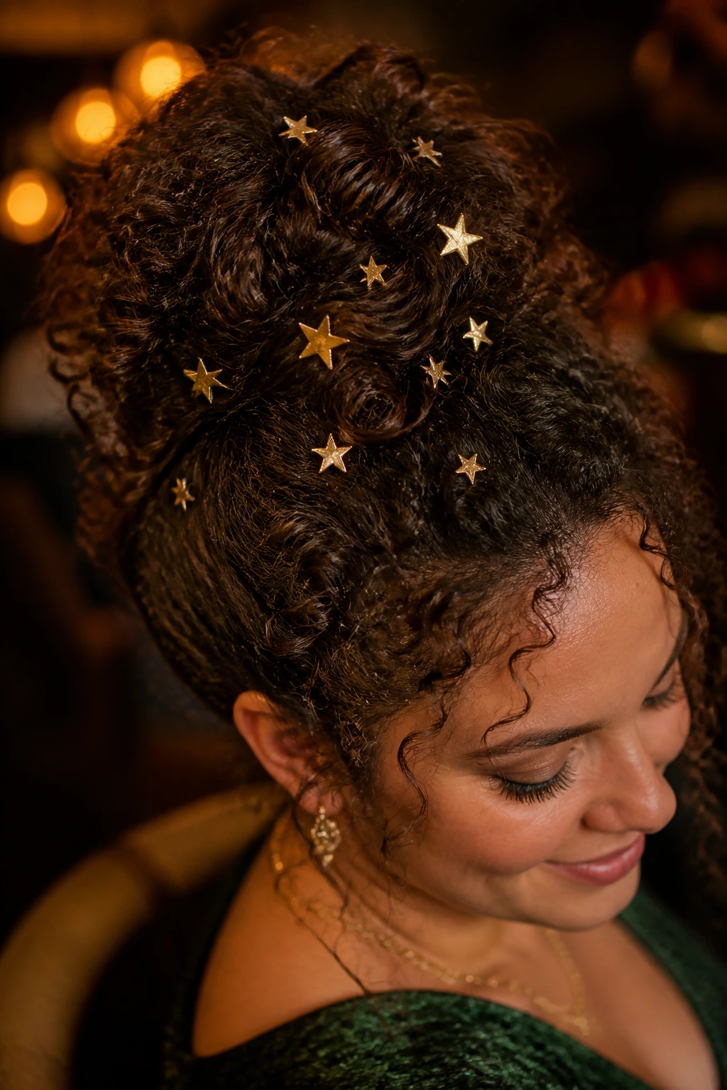 Portrait of a woman with a curly updo and scattered gold star pins.