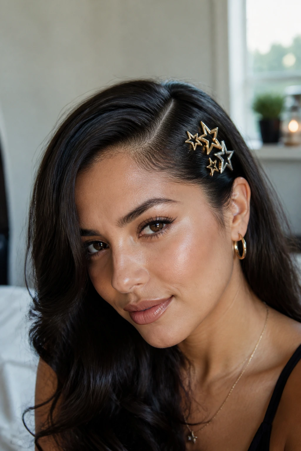 Real woman with deep side part and star pins at temple.