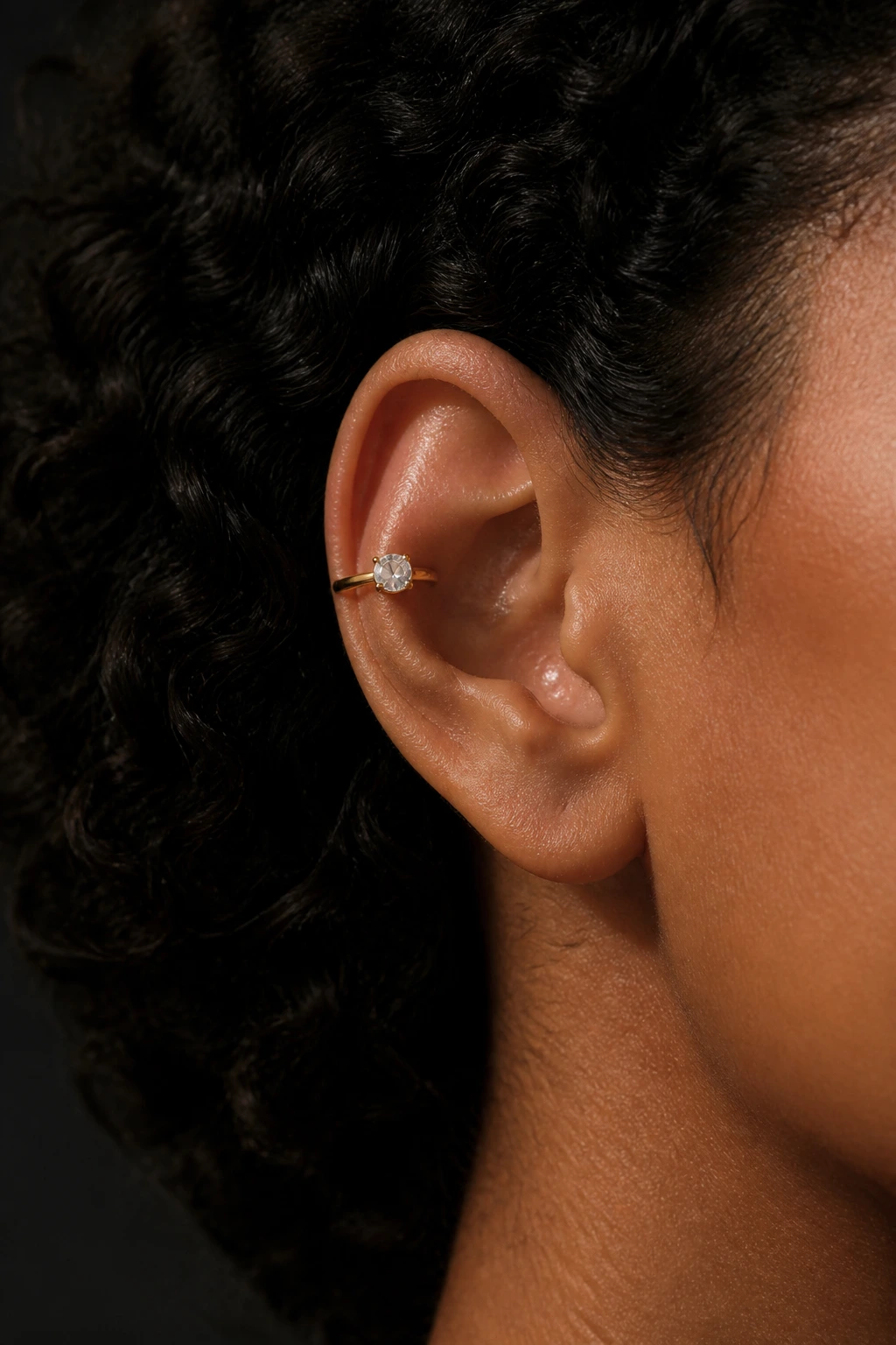 Close-up of floating stone ear cuff on real person