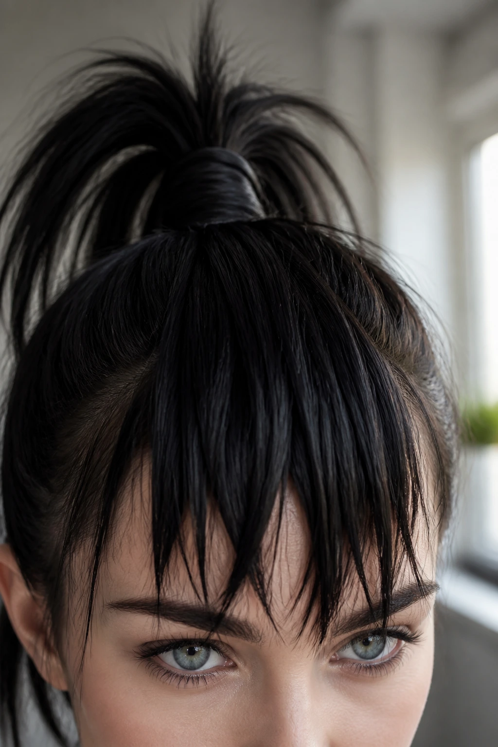 Close-up of hair draped over forehead to create faux bangs from a high ponytail on a real person