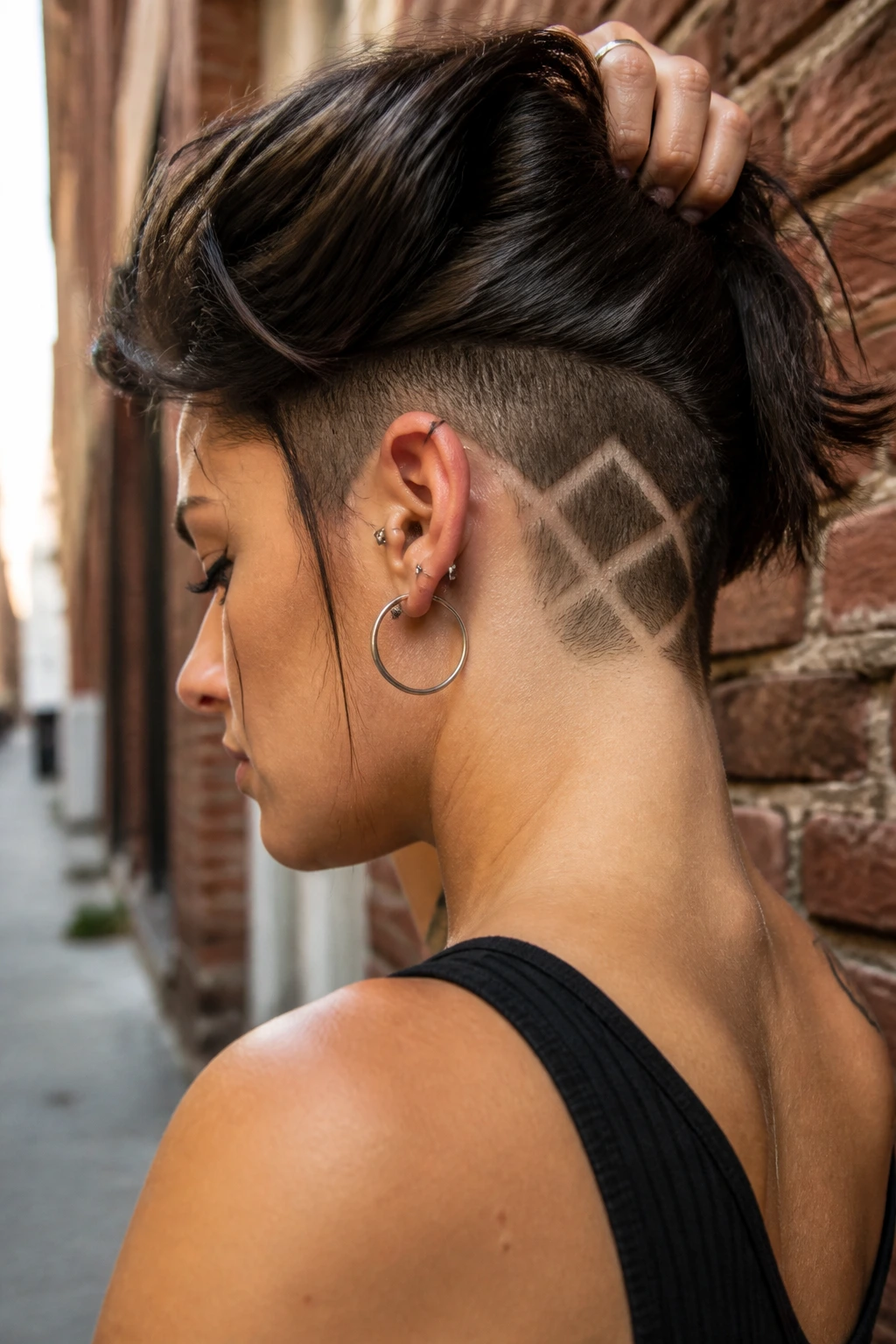 Back-of-neck view showing geometric cutouts in shaved hair