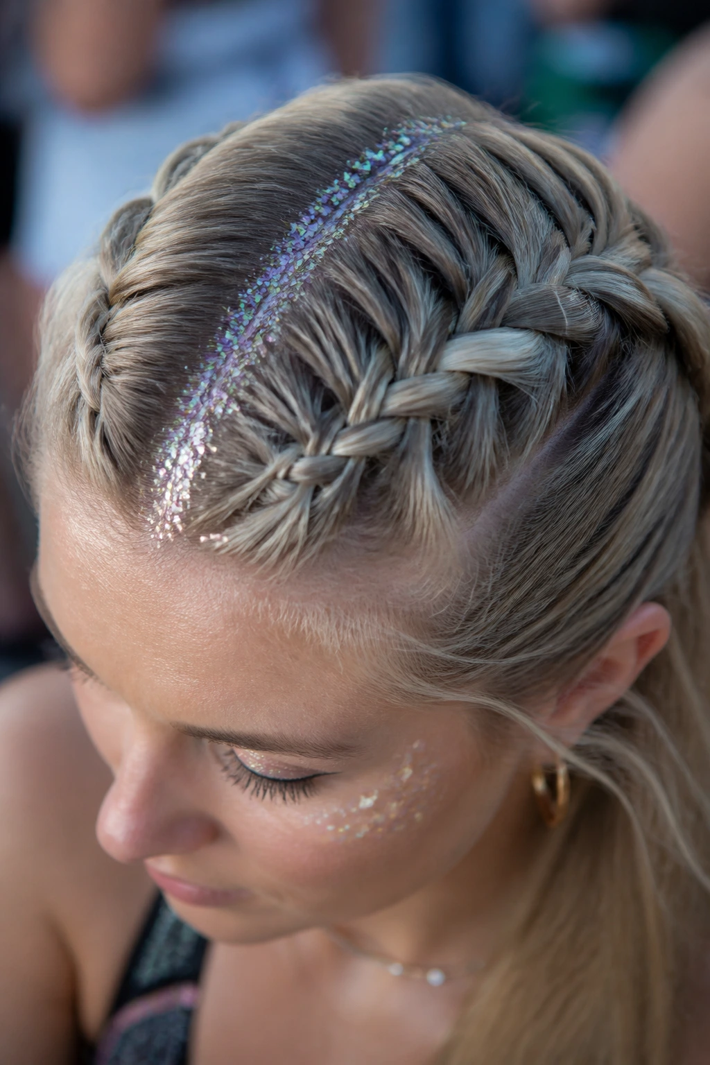 Close-up of a real person with a glittery part braid