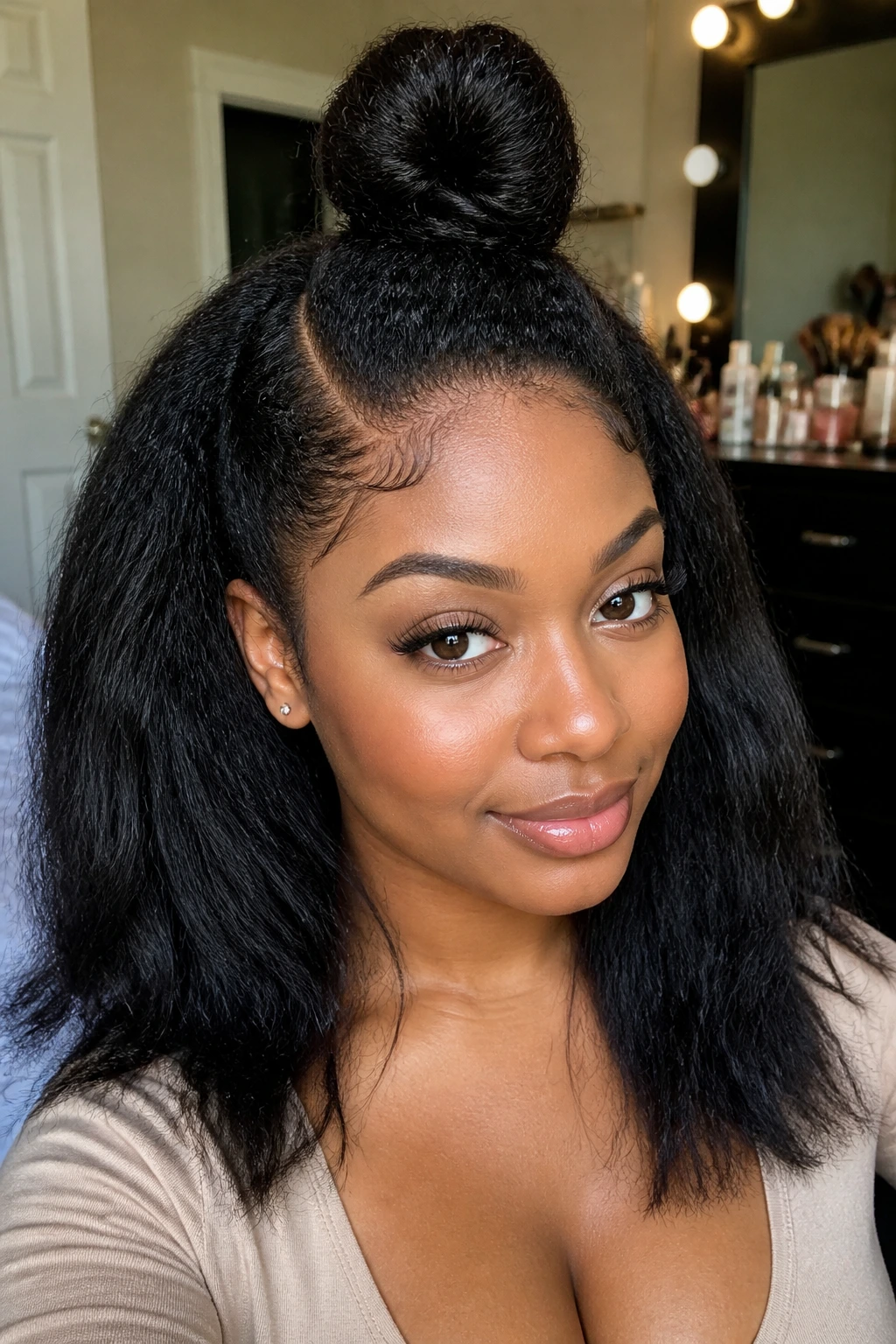 Real woman with half-up half-down top knot hairstyle.