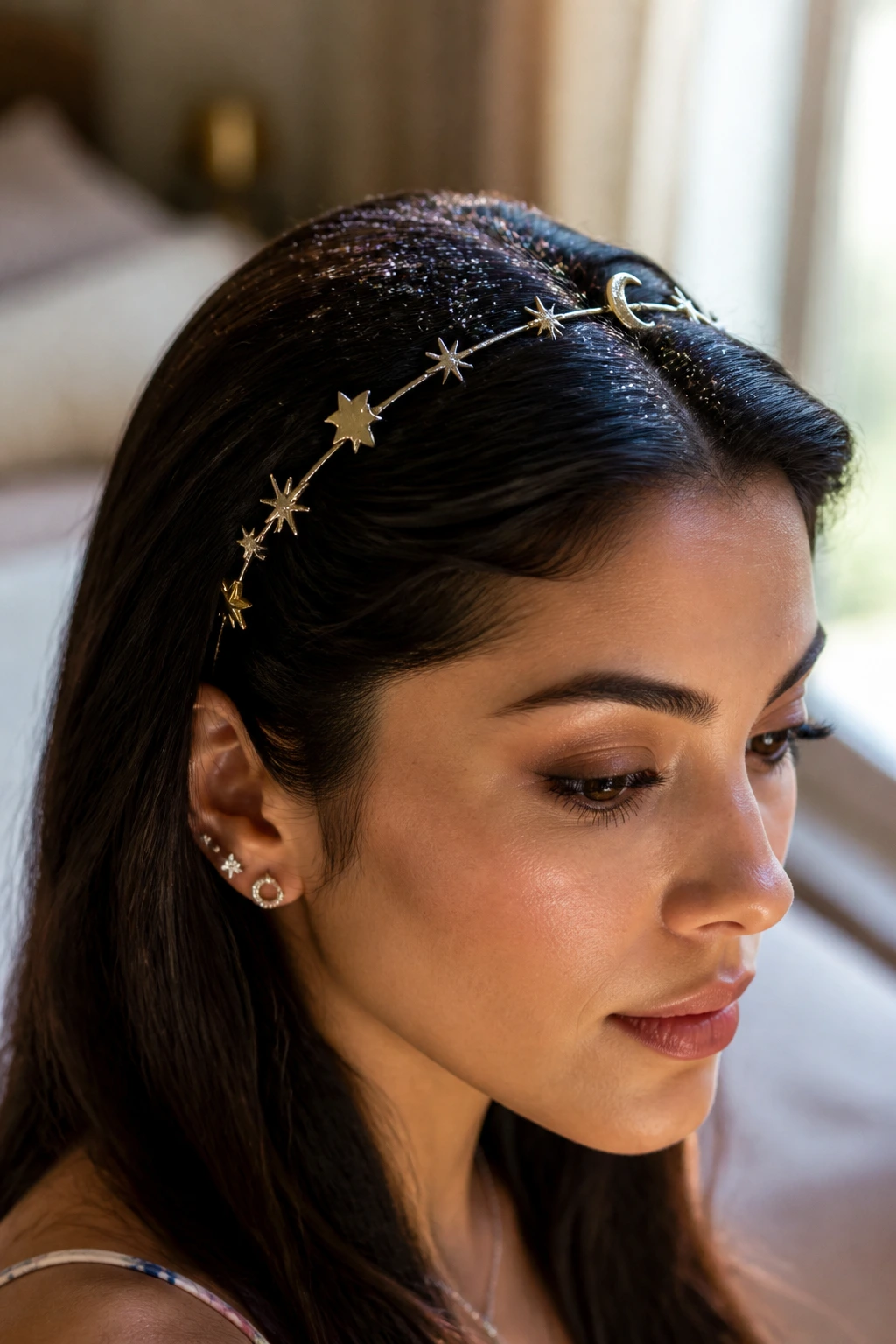 Close-up of a real woman wearing a starry headband in natural window light