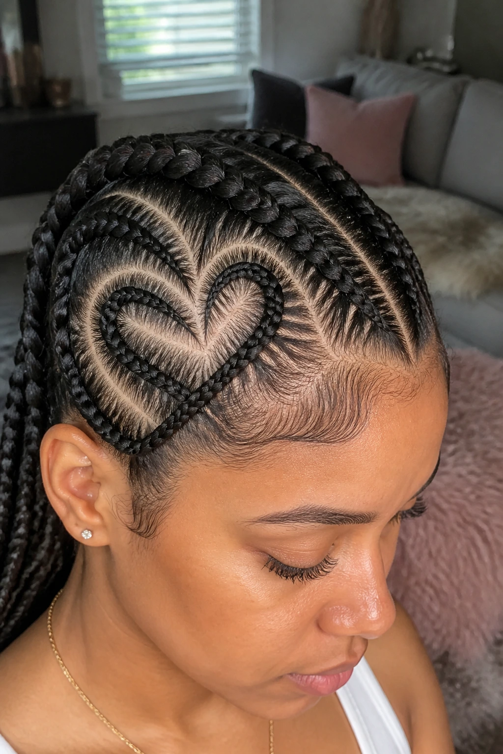 Close-up of heart-shaped cornrows on a real person