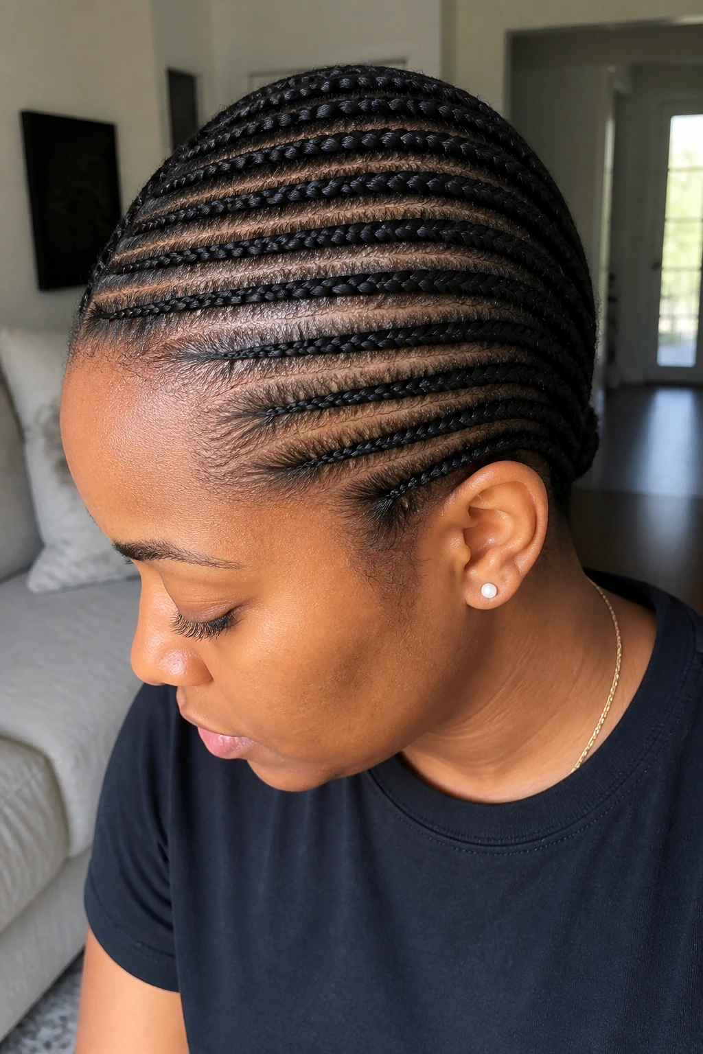 Close-up of real woman with horizontal cornrows across the scalp