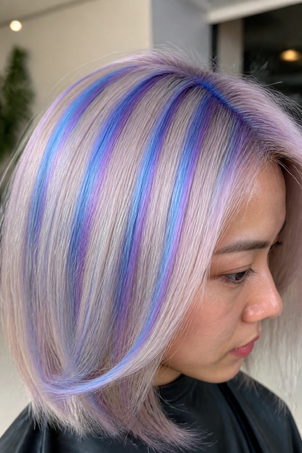 Close-up of lavender-blue holographic stripes in hair on a real person
