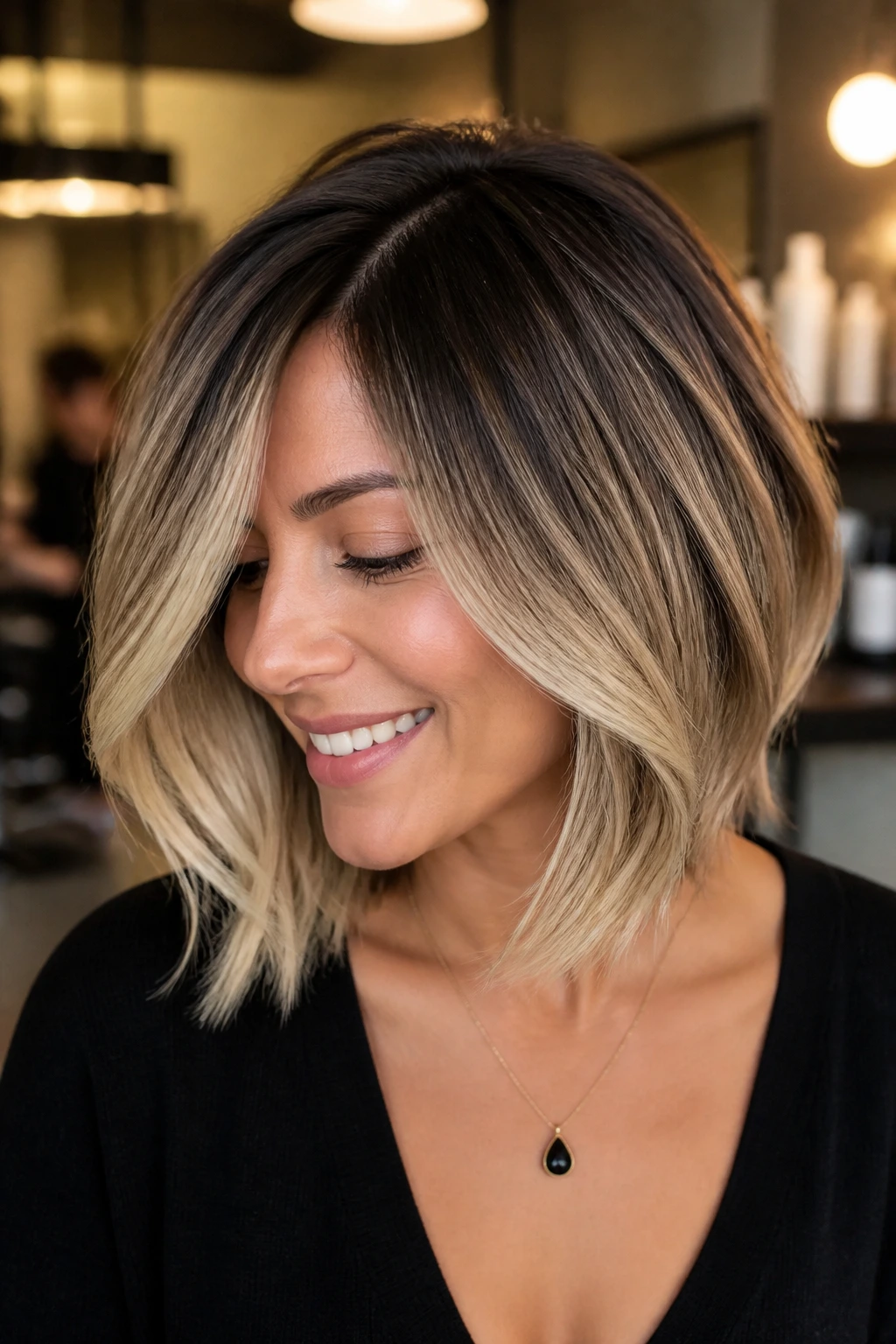 Close-up of a real woman with layered bob and balayage coloring