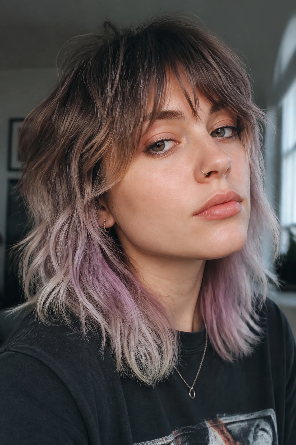 Close-up of a real woman with layered shag and pastel ends