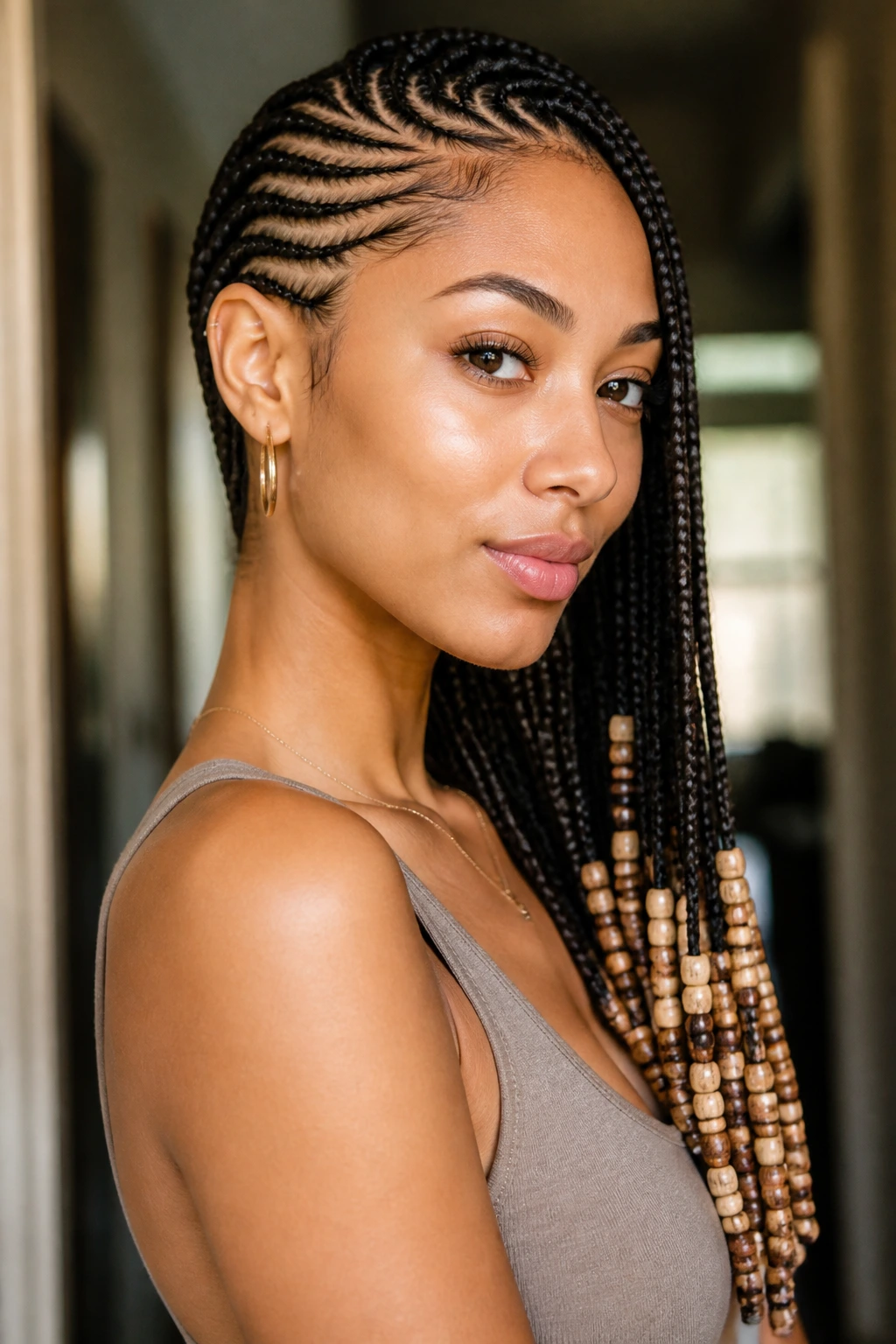 Close-up of lemonade braids with beaded ends on a real person