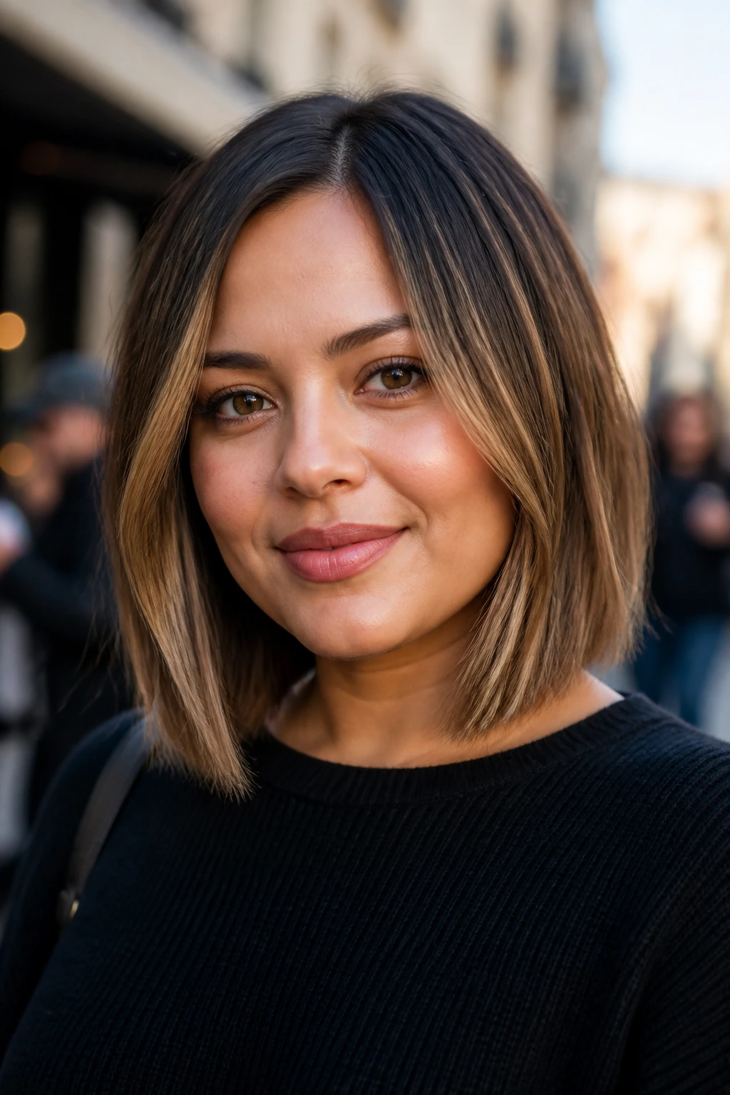 Close-up of a real woman with a shoulder-grazing lob transitioning bob