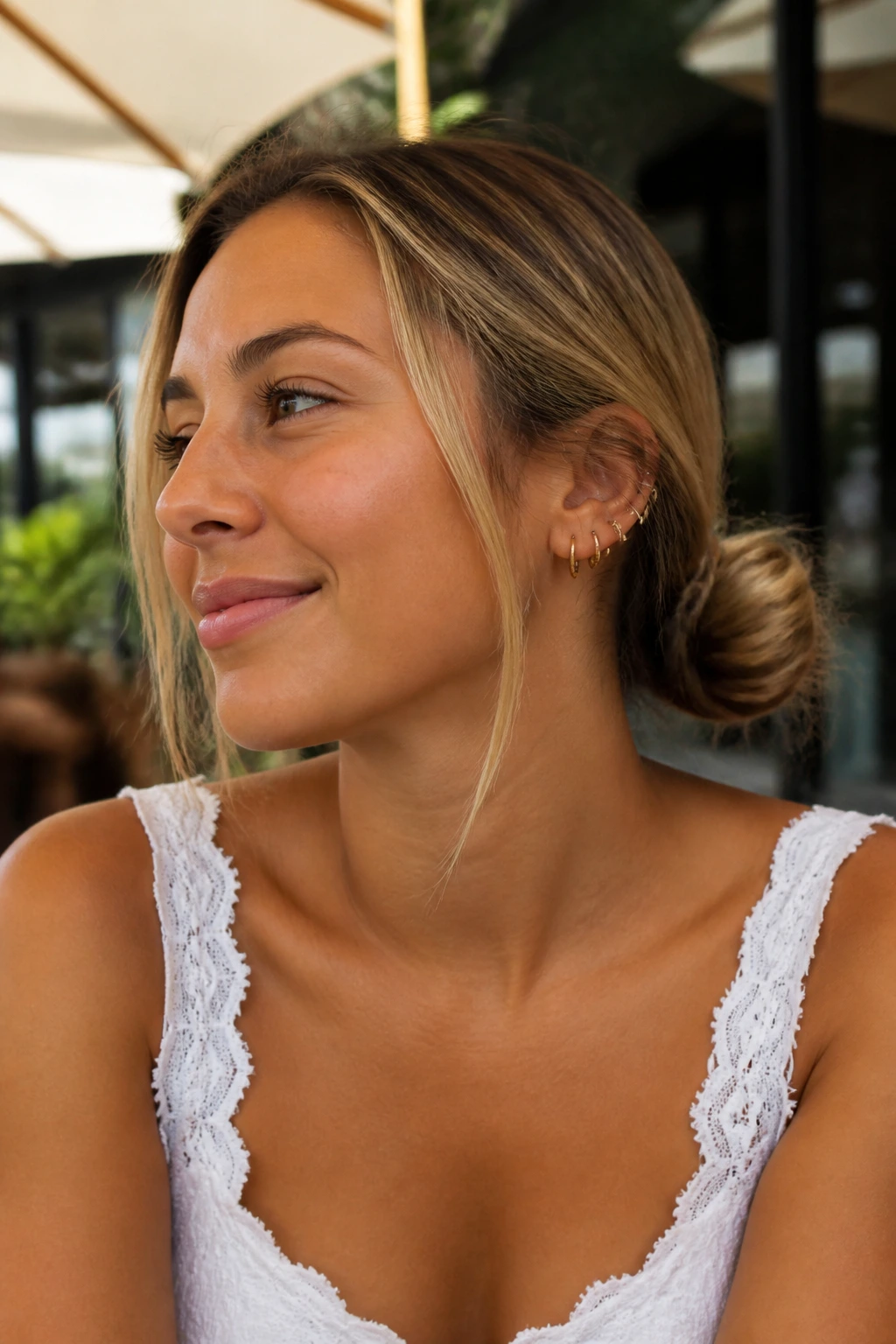 Close-up of two low pigtail buns on a real person