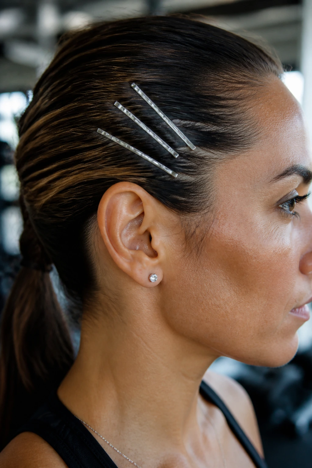 Matte silver flat bobby pins flush against scalp