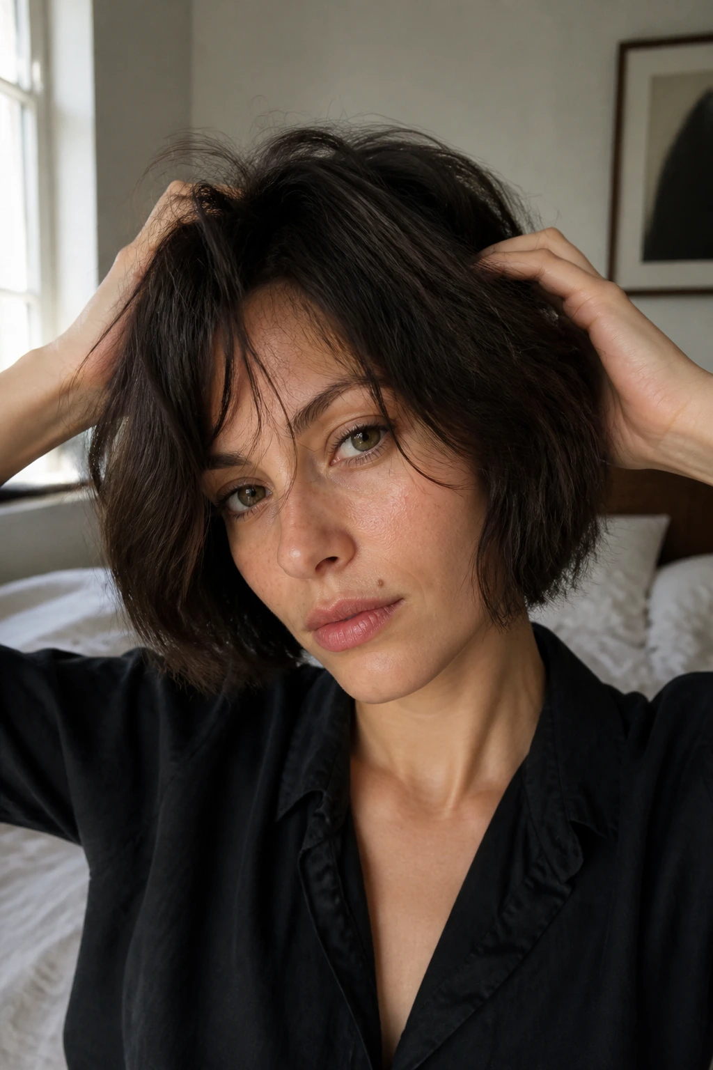 Close-up of real woman with a messy blunt bob dried with fingers