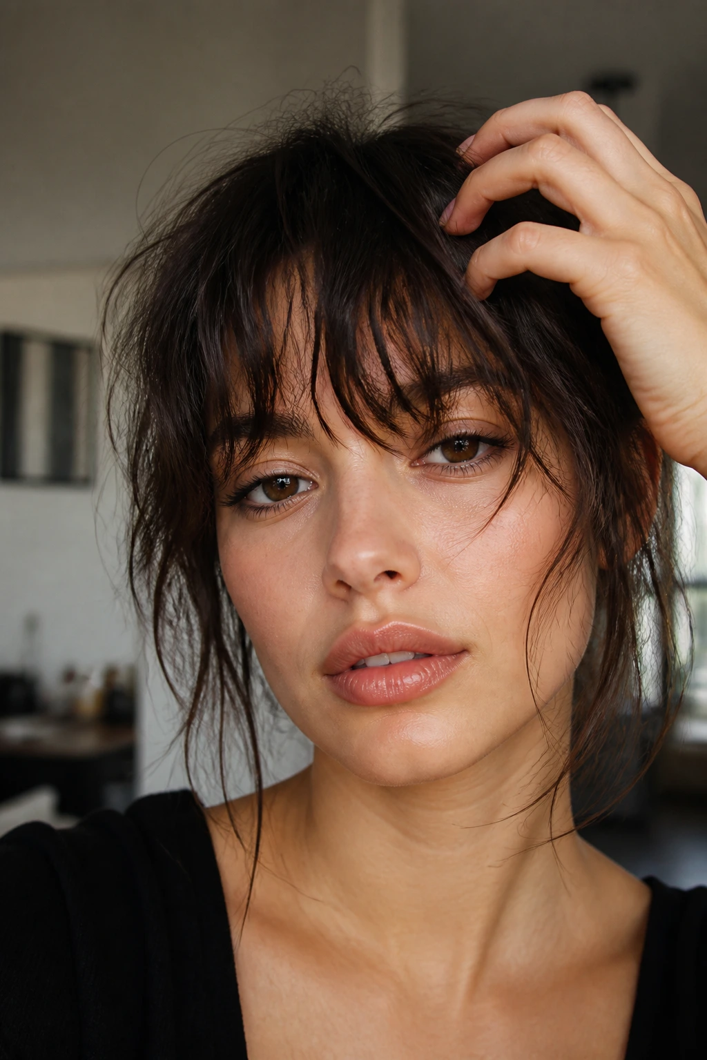 Close-up portrait of a real person with messy textured bangs