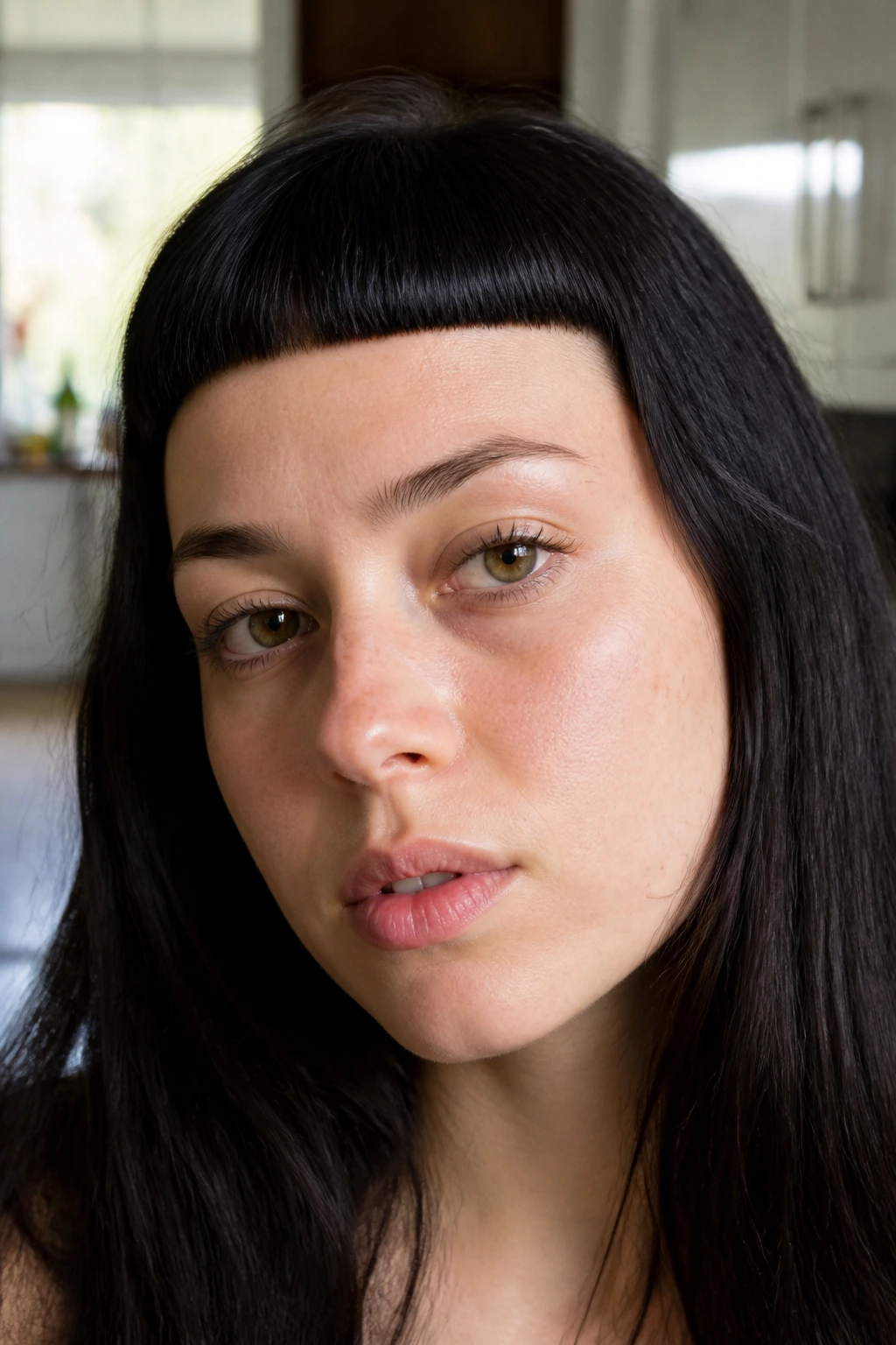 Real person with micro blunt bangs high on the forehead