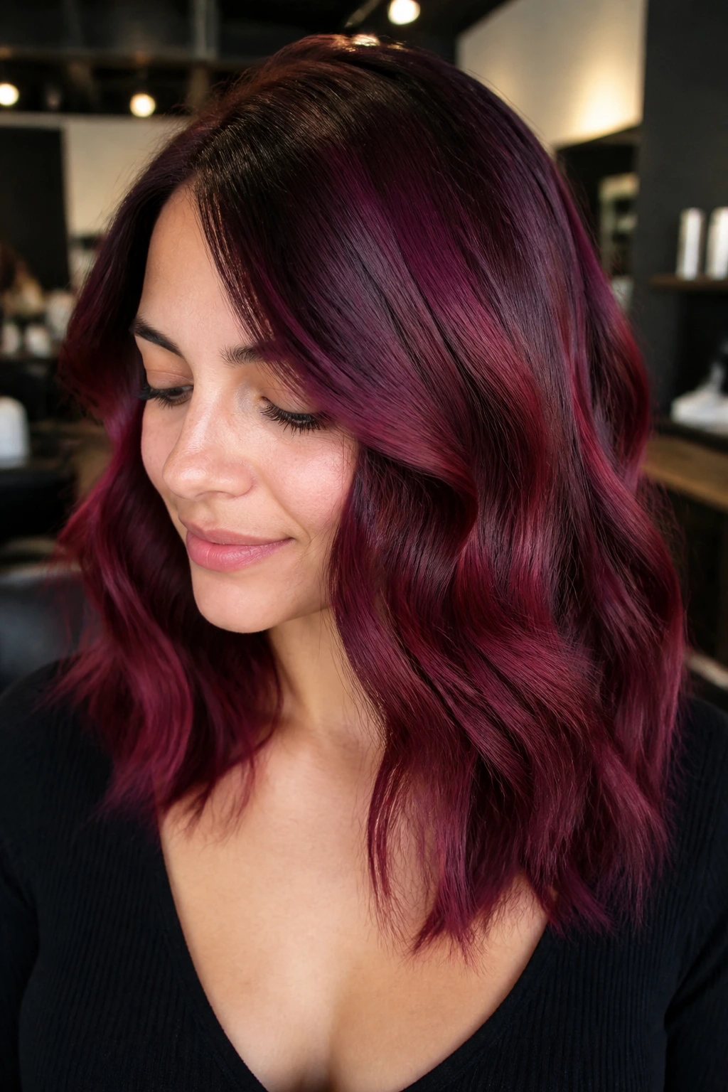 Person with multi-tonal maroon hair showing variations