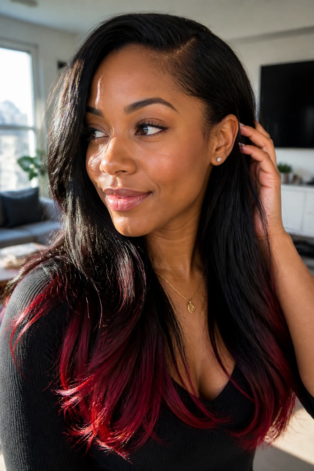 Portrait of a real woman with natural flowing hair and red ends tucked behind the ear.