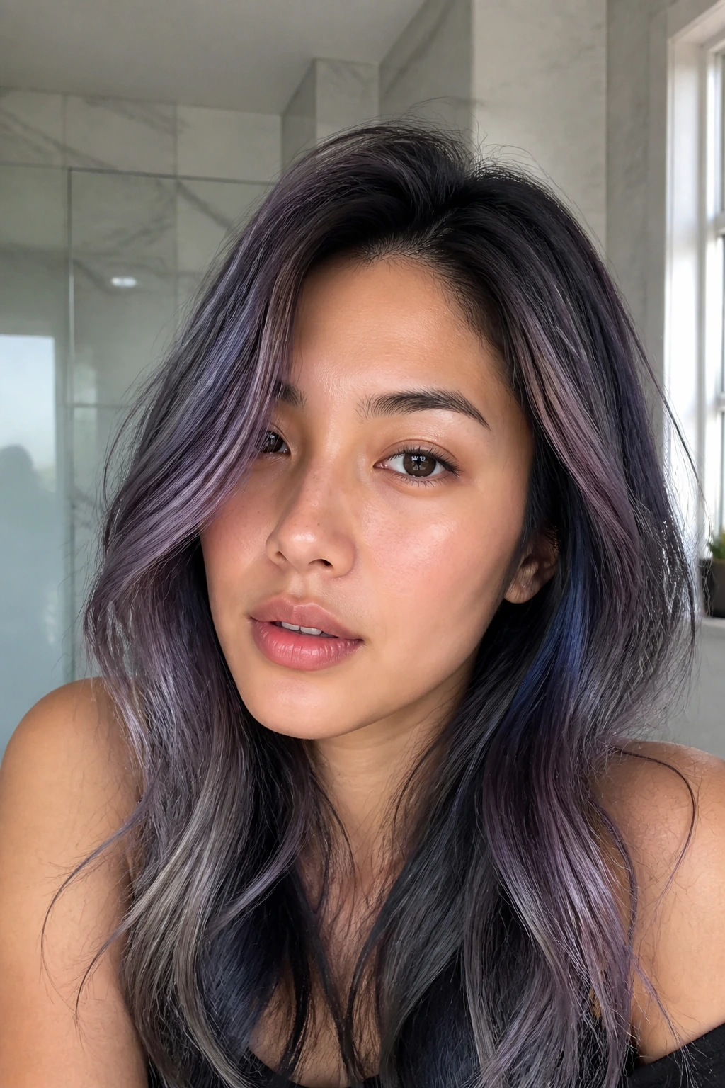 Close-up of an Asian woman with lavender-grey oil-slick hair on dark base