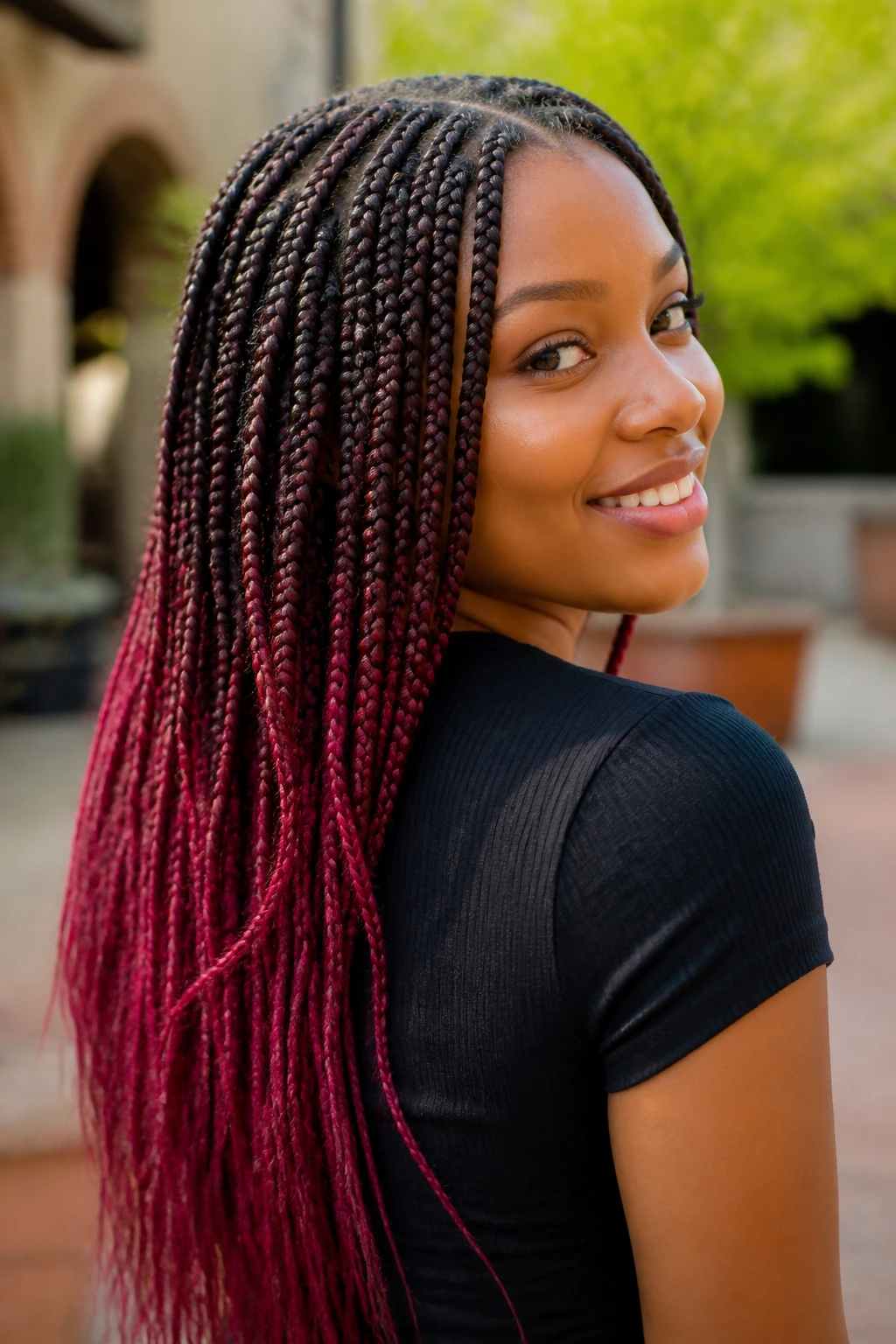 Close-up of colorful ombré box braids on a real person