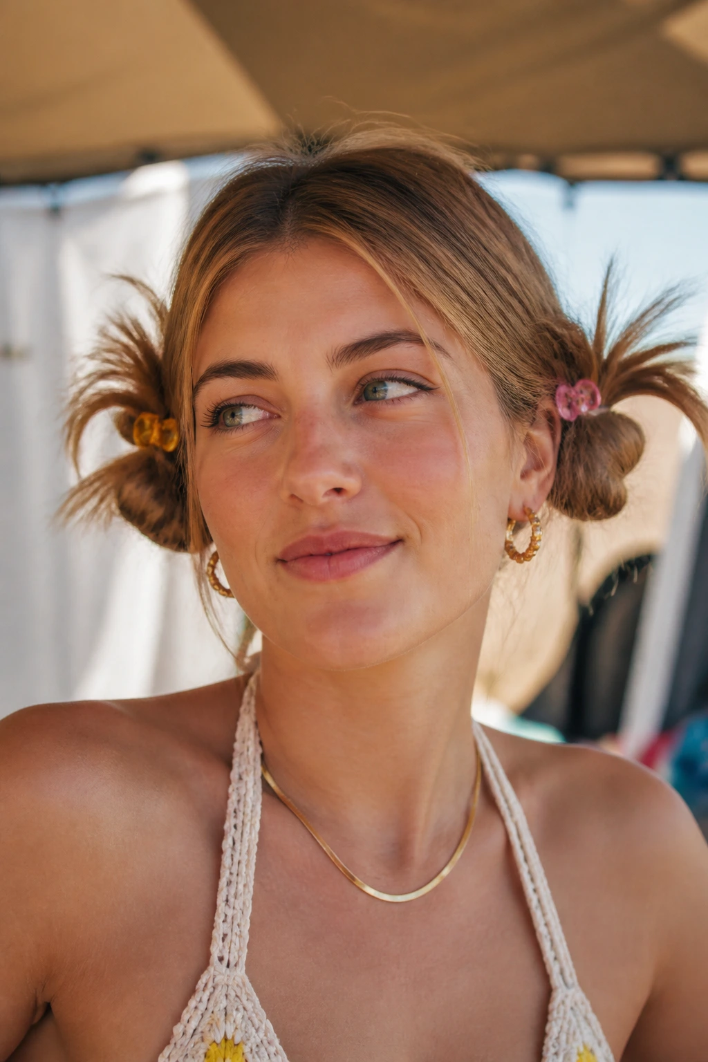 Close-up of a real woman with messy low pigtail buns and retro claw clips