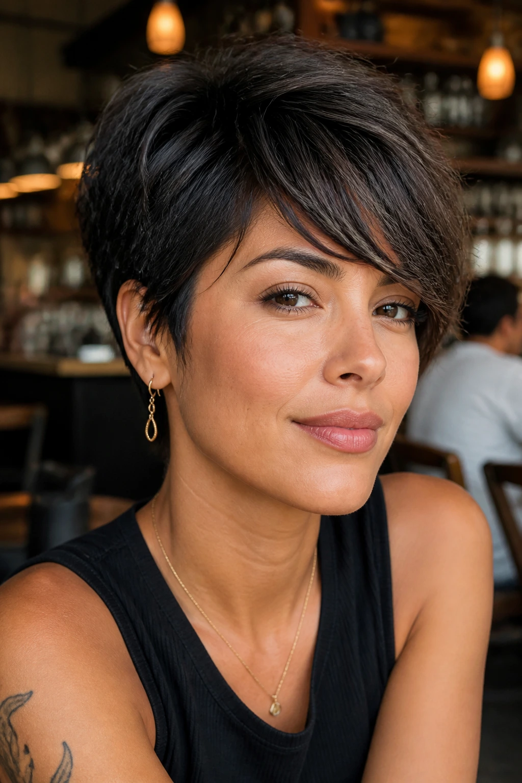 Pixie cut with textured front pieces framing the face