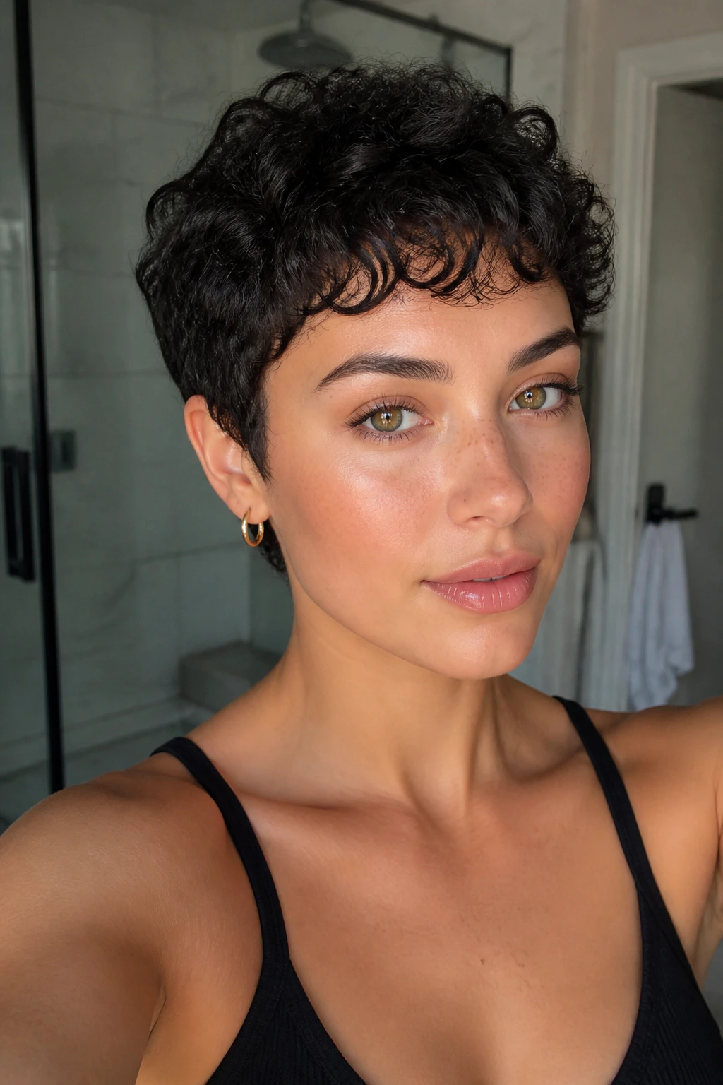 Real woman with pixie cut and micro curly bangs close-up
