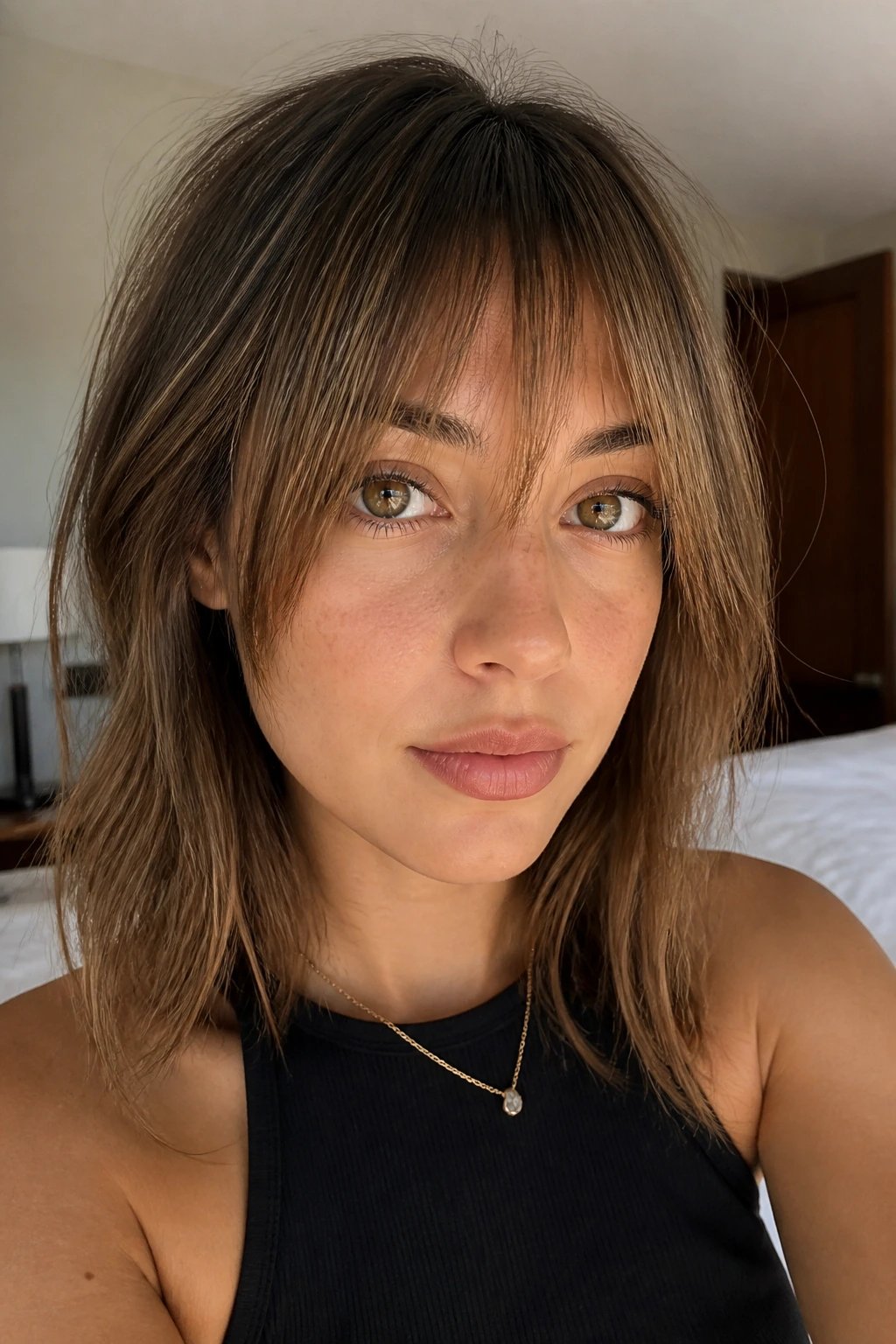 Close-up of real person with point-cut razored fringe and piecey separation