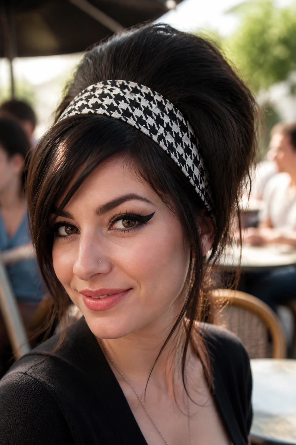 Close-up of a real person wearing a bold patterned retro headband in daylight outdoors.