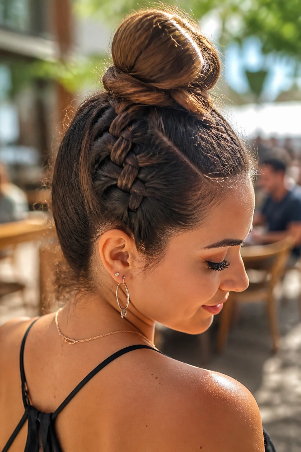 Close-up of reverse Dutch braid forming a top knot on real woman