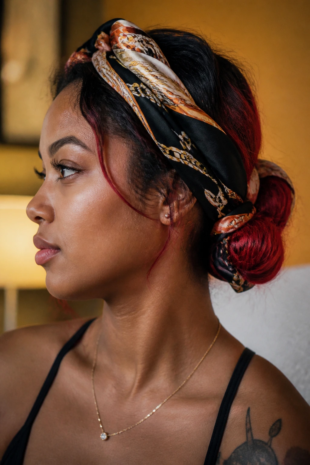 Portrait of a real woman with scarf-wrapped updo and red-tinted hair