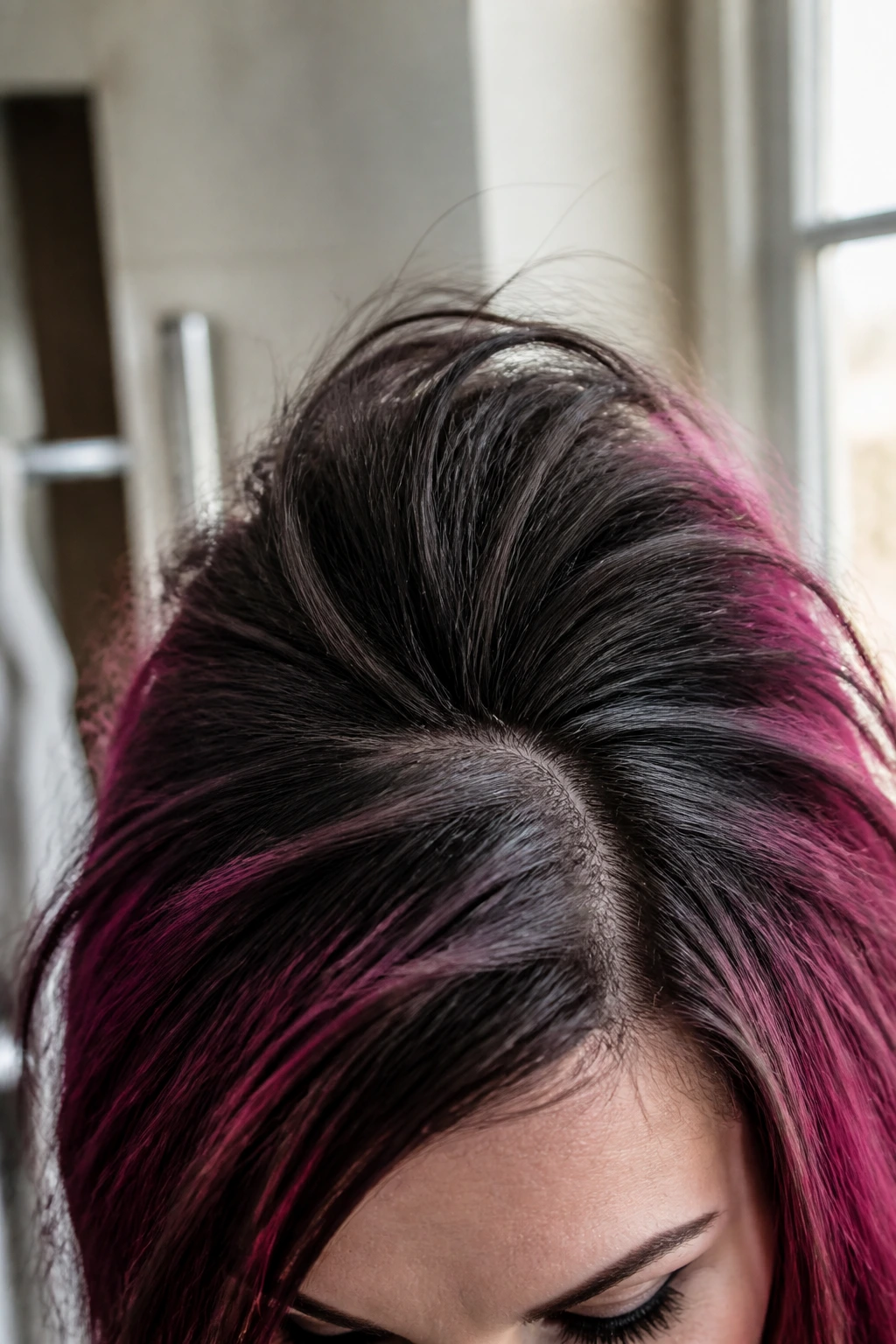 Close-up of teased second-day hair with matte texture and lifted crown on a real person
