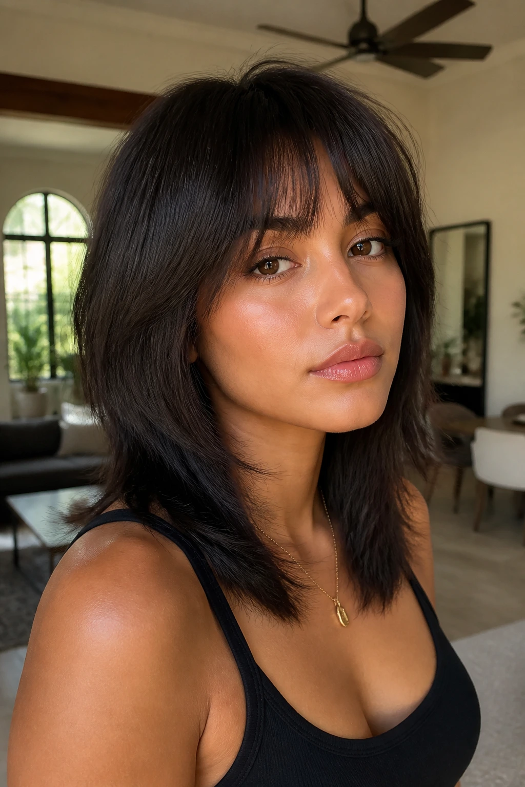 Close-up of a real woman with sleek, layered silk-pressed shag cut