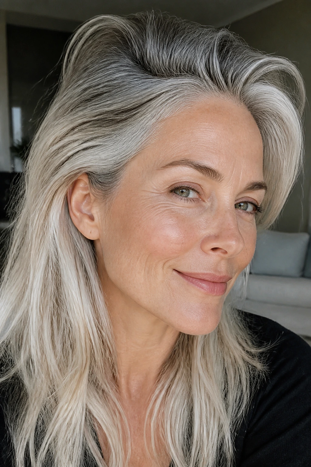 Close-up of hair with slate-grey roots and silver-blonde lengths