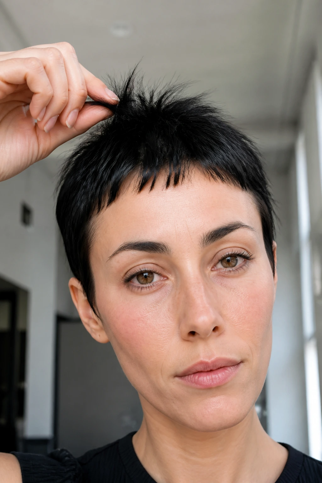 Close-up of a person with ultra-short spiky micro bangs
