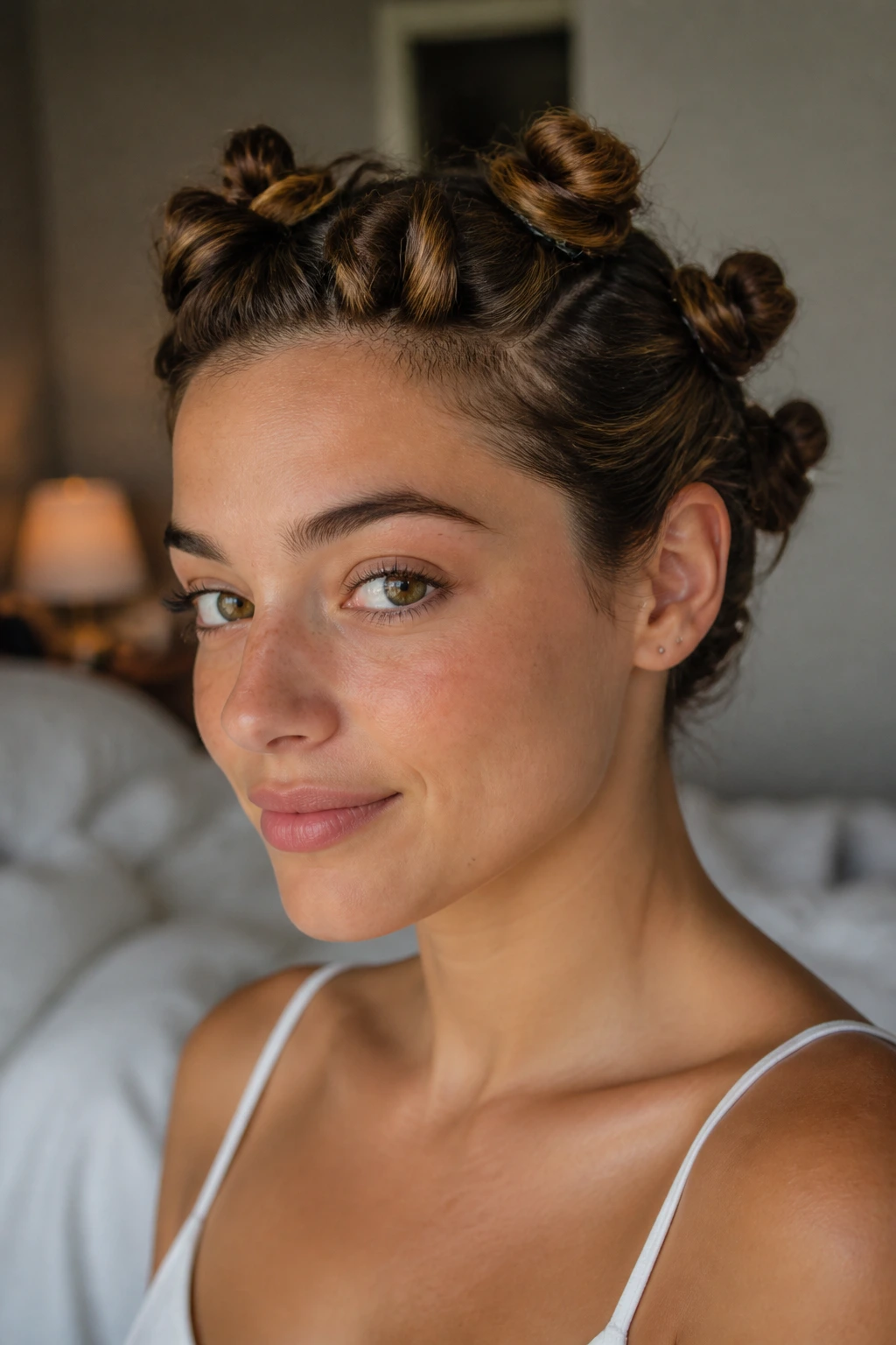 Real woman with twisted buns pinned up for waves