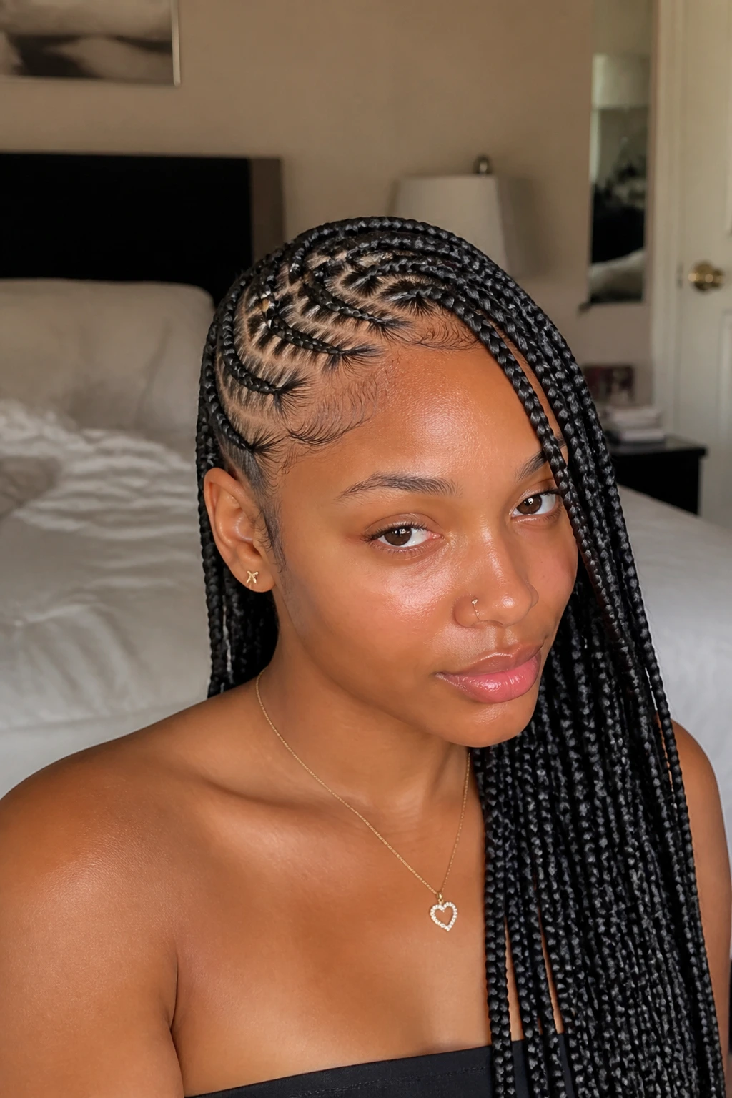 Close-up portrait of a real woman with zig-zag parted lemonade braids framing her face