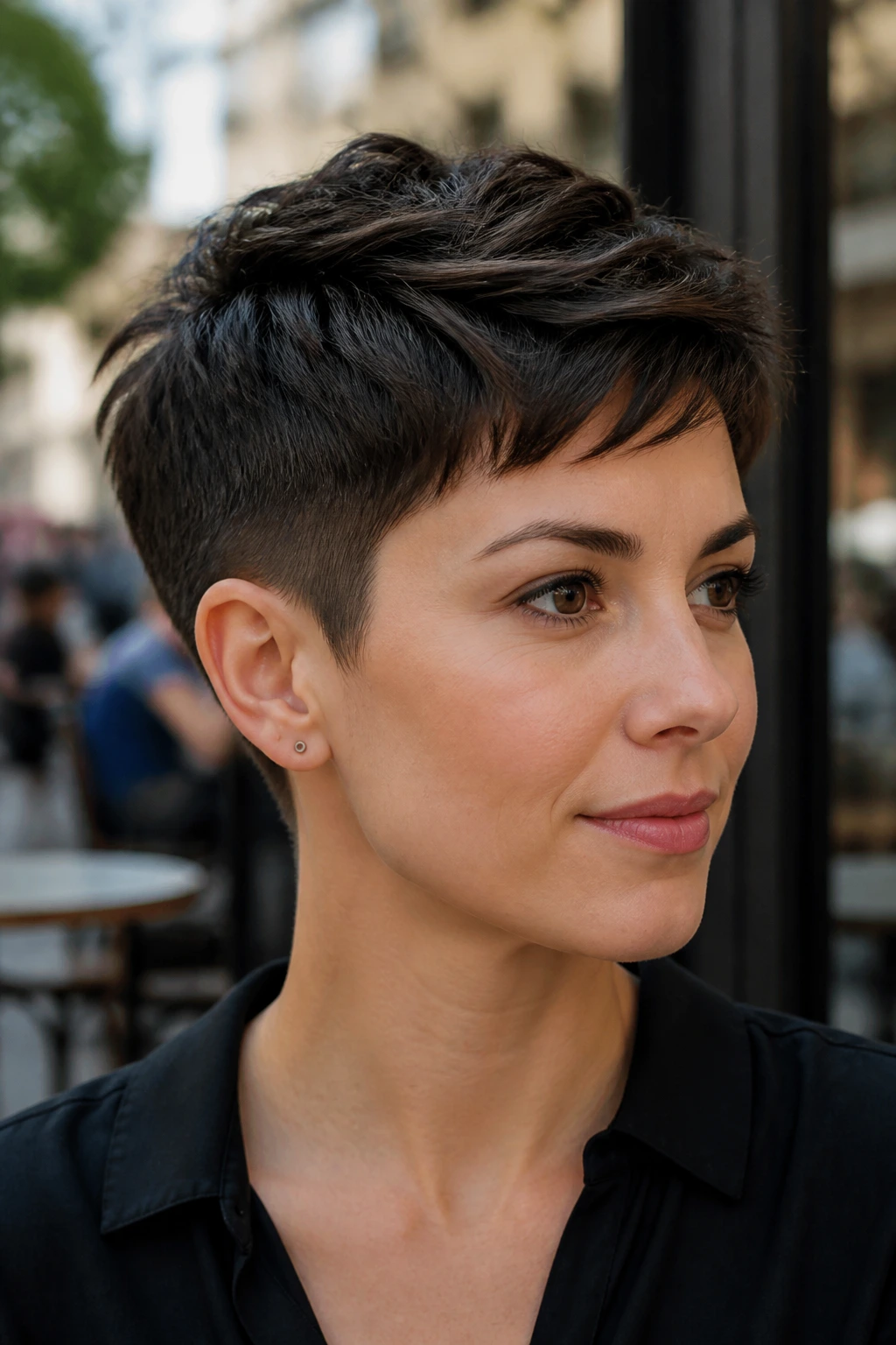 Close-up of a real woman with a classic pixie and tapered sides